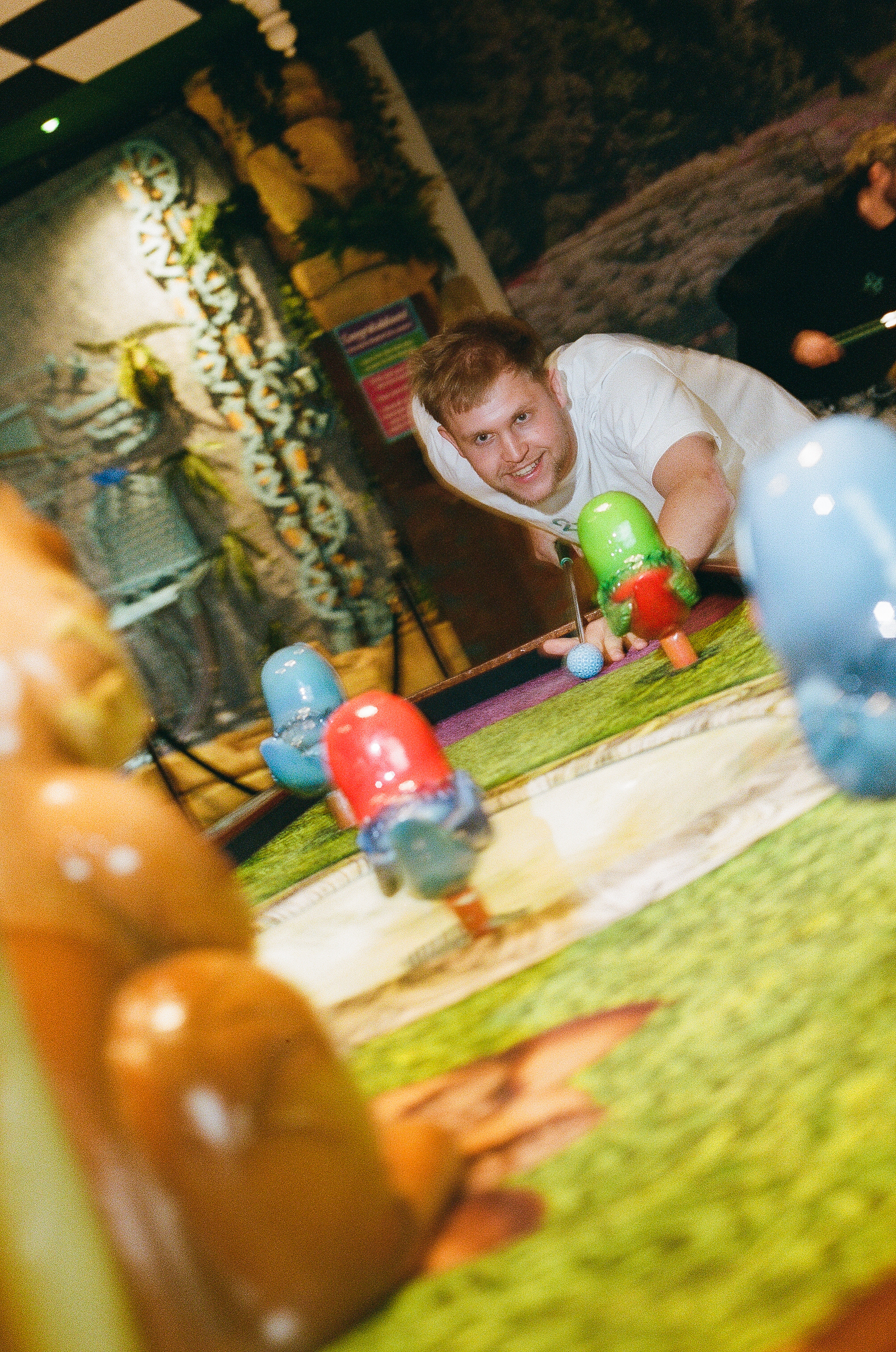 A player lining up a shot at Cue Golf — Flower Bowl Entertainment Centre
